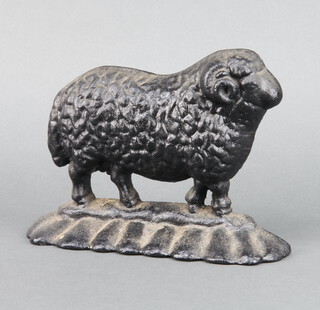 A Victorian black painted cast iron door stop in the form of a standing ram 16cm x 20cm x 5cm 