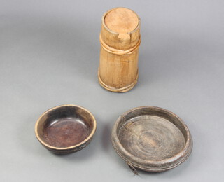 A curious oval coopered flour bin and lid of waisted form 33cm h x 17cm w x 20cm d (old but treated worm) together with 2 turned wooden bowls (1 cracked) 