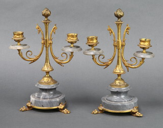 A pair of Victorian grey marble and painted gilt metal twin light candelabrum, raised on socle bases with paw feet 28cm h x 19cm diam. 