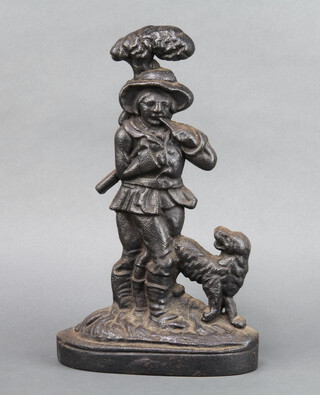 A Victorian cast iron doorstop in the form of a standing gentleman with dog 35cm h x 22cm w x 7cm d 