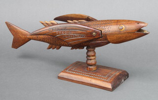 Fred M Christian, a Pitcairn carved hardwood figure of a fish, the fins marked Souvenir from Pitcairn Island, made by Fred M Christian ( grandson of Fletcher Christian, one of the mutineers of HMS Bounty ) 14cm h x 37cm w x 12cm d 