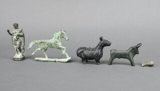 A verdigris bronze figure of a standing Roman 9cm, ditto running horse 8cm x 10cm x 2cm, bronze figure of a standing mythical beast 6cm x 8cm x 4cm, ditto bull 6cm x 7cm x 2cm 
