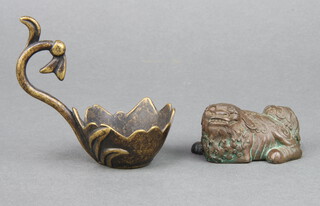 A Chinese bronze figure of a Shi Shi, the base with seal mark 3cm x 5cm x 3cm together with an Eastern bronze ladle 9cm x 3cm 
