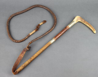 A hunting whip with stag horn grip, leather thong and lash 