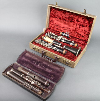 A clarinet, the bowl marked F Buisson Bule, sole distributor Dallas London, cased, a Monzani & Co. 3 piece wooden flute (centre section damaged), cased 
 