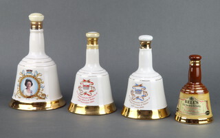A 17cm Bells Wade whisky decanter to commemorate the Queen's birthday April 21st 1986, 2 50cl ditto for the birth of Prince William 1982 and The birth of Prince Harry 1984 together with a ditto 2/3 fl ozs 