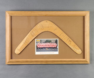 Lions Rugby, a boomerang signed by all members of the 1989 British Lions Rugby Team from the Australian tour. Framed in an oak frame with a postcard of the team