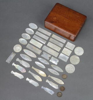 38 various carved mother of pearl game counters comprising 3 circular, 10 oval, 9 in the form of fish, 9 large rectangular ditto, pierced  rectangular and 5 small rectangular, contained in a hardwood box 4cm h x 12cm w x 9cm d 