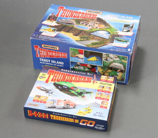 A boxed Matchbox Thunderbirds Tracey Island electronic playset together with a boxed Radio Times Thunderbirds commemorative set.