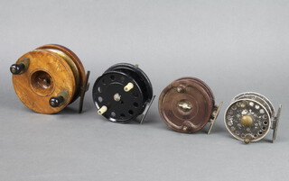 A Milward wooden and brass 5" star back centre pin fishing reel with offset check half wood and brass spool, a Milward Pelican real, an Allcocks centre pin reel and a Grice and Young centre pin reel  