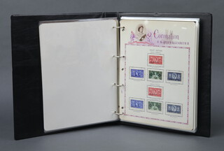 A black ring bound album of Elizabeth II stamps 1953, mint condition 