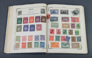 A blue Improved stamp album of used world stamps including GB, Victoria and later, France, Poland etc  