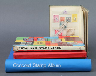 A blue album of various used GB stamps Victoria to George VI including Commonwealth, The Blue Ribbon stamp album of used world stamps, orange stock book of world stamps and a quantity of loose stamps, The Royal Mail stamp album with world stamps and a stock book of GB and world stamps   