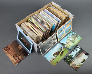 A quantity of black and white and coloured postcards 