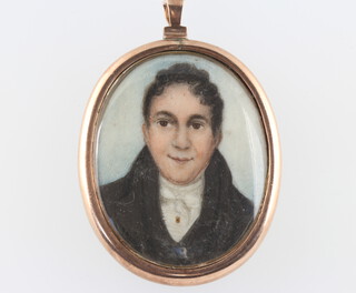 A 19th Century oval miniature portrait of a young gentleman contained in a gilt pendant 5cm x 3cm 