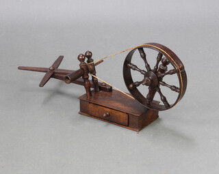 An 18th Century mahogany wool winder fitted a drawer 27cm x 64cm x 12cm 