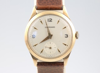 A gentleman's Garrard 9ct yellow gold wristwatch with seconds at 6 o'clock, contained in a 30mm case on a leather strap 