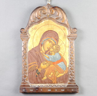 20th Century icon painted on wood, Madonna and child in a carved architectural frame 40cm x 26cm 