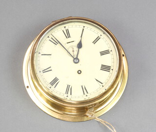 A ward room style clock, the 20cm dial with Roman numerals and subsidiary second hand, contained in a brass case 9cm x 26cm, the reverse marked BB642 62W 1106 135 68031W1011 