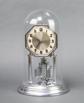 An Art Deco 400 day clock with octagonal dial, Arabic numerals, contained in a chrome case complete with key and glass dome 31cm h x 19cm  