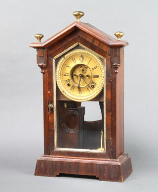 A 19th Century American striking shelf clock with 11cm paper dial with Roman numerals and visible escapement, contained in a walnut case enclosed by glazed panelled door, complete with pendulum and key 44cm h x 24cm w x 11cm d  