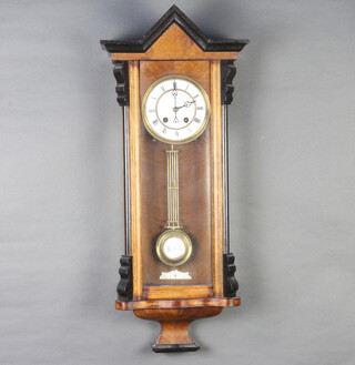A Victorian Vienna style regulator with 12cm enamelled dial Roman numerals and gridiron pendulum, complete with key, contained in a walnut case 75cm h x 52cm w x 16cm d 