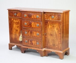 A Georgian style breakfront mahogany sideboard with crossbanded top fitted 4 long drawers flanked by cupboards, raised on bracket feet 73cm h x 96cm w x 33cm d (some contact marks in places) 