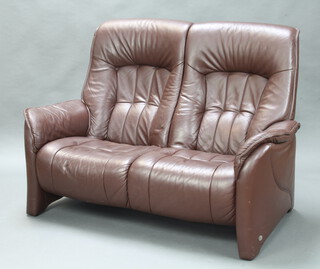 Himolla, a 2 seat sofa upholstered in brown leather 105cm h x 148cm w x 70cm d (seat 110cm x 42cm, some slight scuffing to the seat and back in places) 