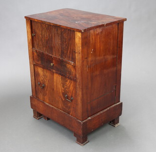 A 19th Century Continental mahogany commode with cupboard enclosed by a tambour shutting above 1 long drawer and commode drawer 76cm h x 54cm w x 39cm d (split to top, veneer missing in places, sun bleached in places, slight warp to sides) 