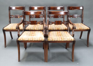 A set of 6 Georgian style mahogany bar back dining chairs, raised on sabre supports comprising 2 carvers 85cm x 51cm and 4 standard chairs 83cm x 46cm x 43cm  (all have contact marks in places, 1 carver and 2 standard chairs have some small sections of veneer missing)  
