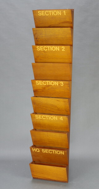 A Ministry of Works 10 section wall mounted letter rack marked Section 1, 2, 3, 4 and Headquarters, 160cm h x 35cm w x 12cm d 
