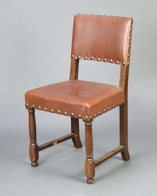 A Cromwellian style oak framed dining chair with upholstered seat and back, raised on turned and block supports 88cm h x 37cm w x 42cm d (seat 34cm x 32cm) 