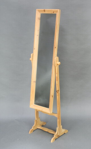 A rectangular plate cheval mirror contained in a pine frame 153cm h x 37cm w x 31cm d 
