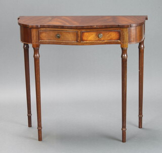 A Georgian style mahogany crossbanded demi-lune side table fitted 2 drawers, raised on turned and fluted supports 72cm h x 80cm w x 34cm d (some light water damage to the top)  