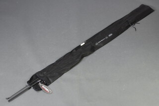 A Mitchell 40G to 100G sea bass fishing rod in black cloth bag 
