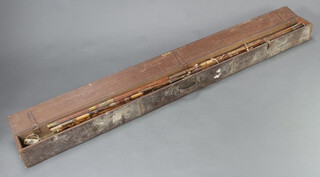 A vintage fishing rod box containing various Victorian and later part rods etc 