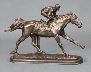 A bronzed figure of a race horse with jockey up 40cm h x 59cm w x 15cm w (tail cracked) 