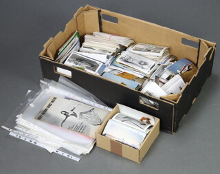 A large collection of black and white and coloured photographs of civil aircraft (some stuck together) 