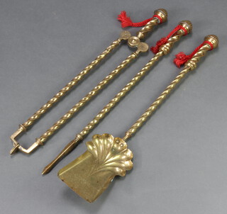 A Victorian 3 piece brass fireside companion set with spiral decoration comprising shovel, poker and tongs 