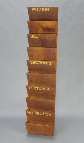 A Ministry of Works 10 section wall mounted letter rack marked Section, SE, 3, 4 and Headquarters, 160cm h x 35cm w x 12cm d 