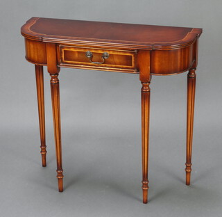 A Georgian style mahogany side table fitted a frieze drawer, raised on turned and fluted supports 75cm h x 80cm w x 29cm d (some contact marks to the top) 