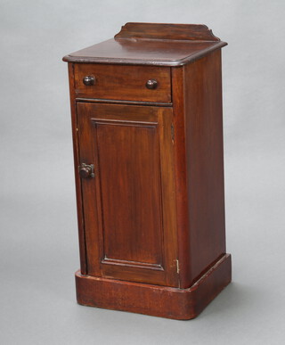 A Victorian mahogany pot cupboard with raised back fitted a drawer above a cupboard, raised on a platform base 80cm h x 39cm w x 34cm d 