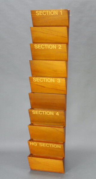 A Ministry of Works 10 section wall mounted letter rack marked Section 1, 2, 3, 4 and Headquarters, 160cm h x 35cm w x 12cm d 