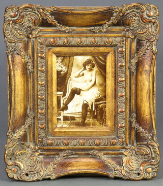 A set of 4 reproduction Edwardian black and white photographs "saucy ladies" contained in decorative gilt frames 33cm x 40cm and 40cm x 24cm 