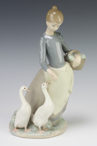 A Lladro figure of a girl with basket feeding geese 24cm and three Coalport figures - Carla 13cm, Cassie 13cm and Eloise 13cm 