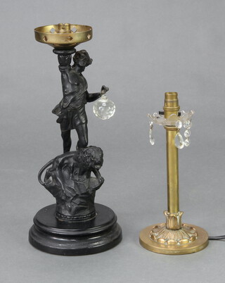 A 19th Century spelter figure of a standing man with lion, converted to an electric table lamp, raised on a socle metal base 40cm x 15cm and a gilt metal and glass table lamp 28cm x 12cm 