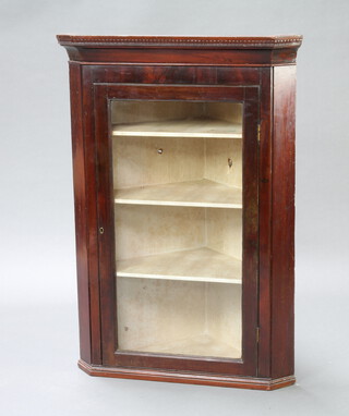 A 19th Century mahogany hanging corner cabinet with moulded cornice enclosed by a glazed panelled door 109cm h x 76cm w x 53cm d 