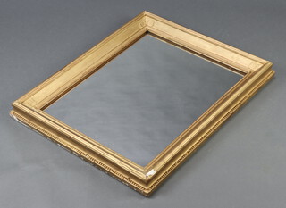 A 19th Century rectangular plate wall mirror contained in a decorative gilt frame 67cm x 82cm 