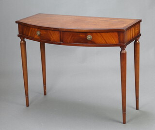 A Georgian style inlaid mahogany bow front side table fitted 2 drawers, raised on turned supports 73cm h x 92cm w x 44cm d (small section of veneer missing to front left hand edge) 