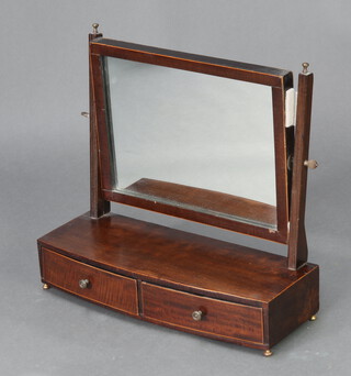 A 19th Century rectangular plate dressing table mirror in a mahogany swing frame, the bow front base fitted 2 drawers raised on bun feet 40cm h x 44cm w x 17cm d 